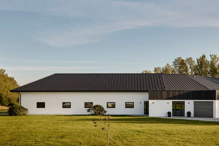 Luxury home with a roof of DS Nordic Click Seam 475